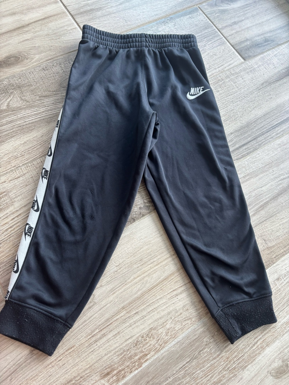 Nike Black Kids Joggers with White Logo Tape size 6-7